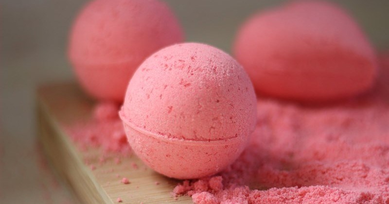 a photo of a round pink bath bomb - cover for a diy bath bomb