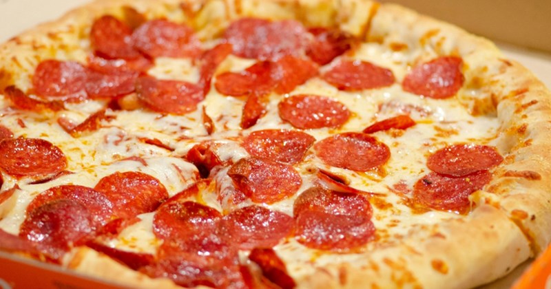 Closeup of takeout pepperoni pizza
