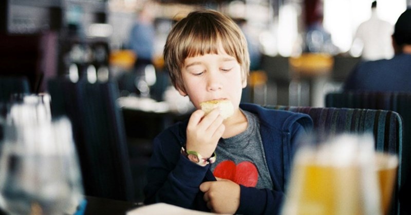 8-year-old boy helps overwhelmed server at an understaffed restaurant, mom beams with pride: 'I've been trying to teach my kid about kindness and empathy…'