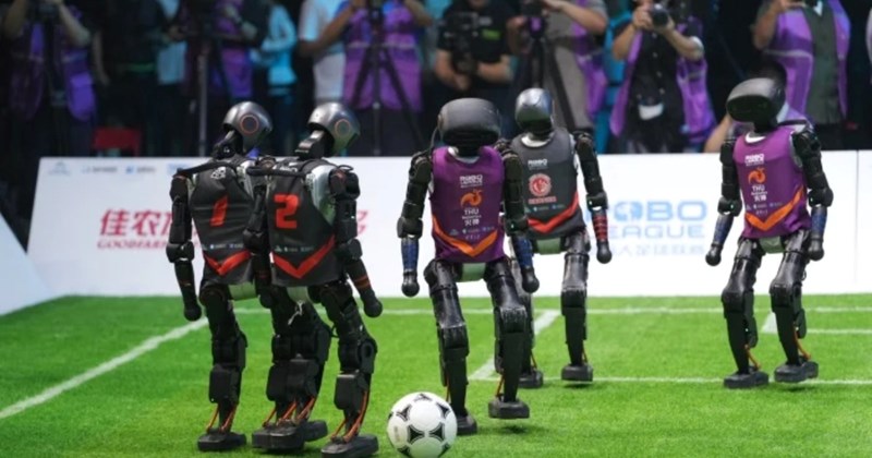 robot football China 2025, World Robot Conference soccer match, AI robots playing football, autonomous robots sports, robot soccer Beijing, robot athletes, Chinese robot soccer team, AI robot competition
