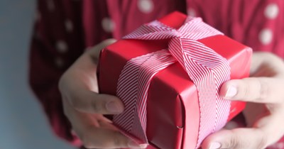 Woman bans coworker from Secret Santa after unexpected employee showdown over gift exchange rules: 'You either play or you don't'