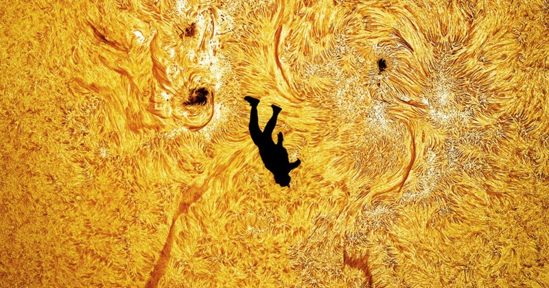 greatest photo ever taken sun skydive silhouette real cosmic picture Andrew McCarthy viral image skydiver sun transit photography